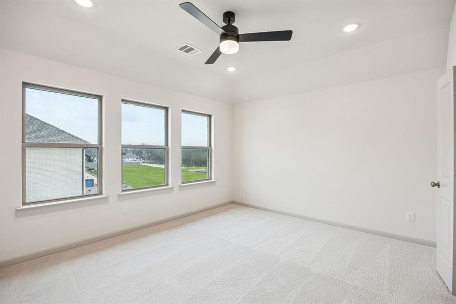 With high ceilings, plush carpeting and a wall of windows, this owner's suit is the perfect place for rest and relaxation.