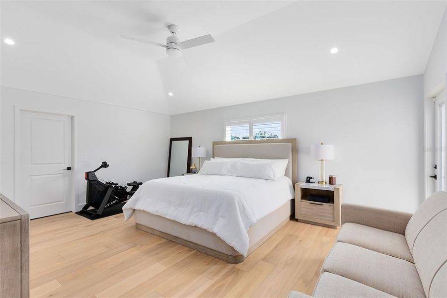 Your primary bedroom has soaring vaulted ceilings.