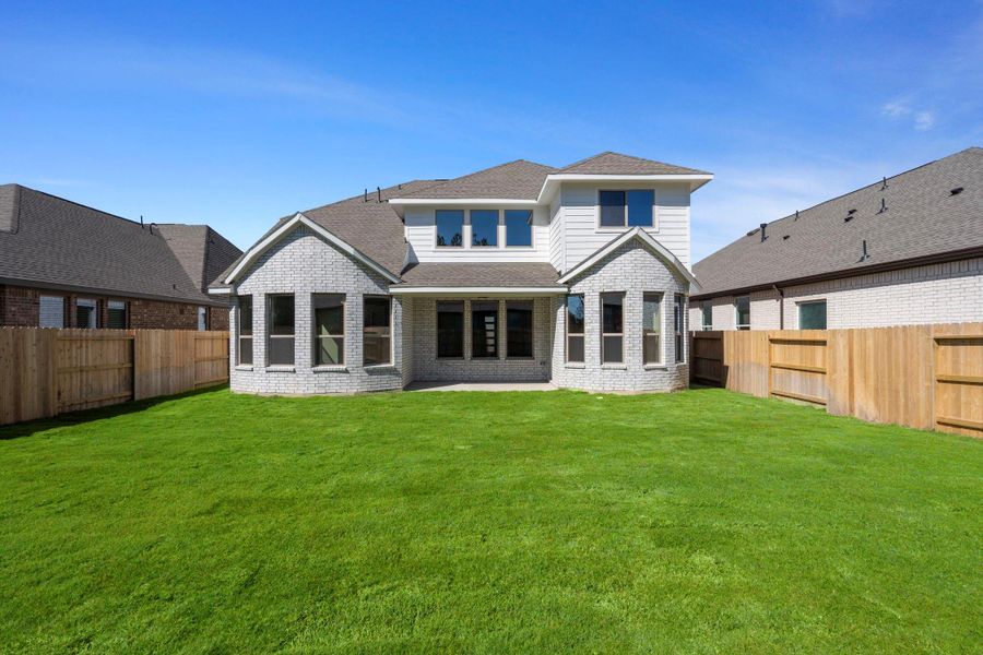 Exterior details and patio area of a home in The Trails, New Caney (Image 24).