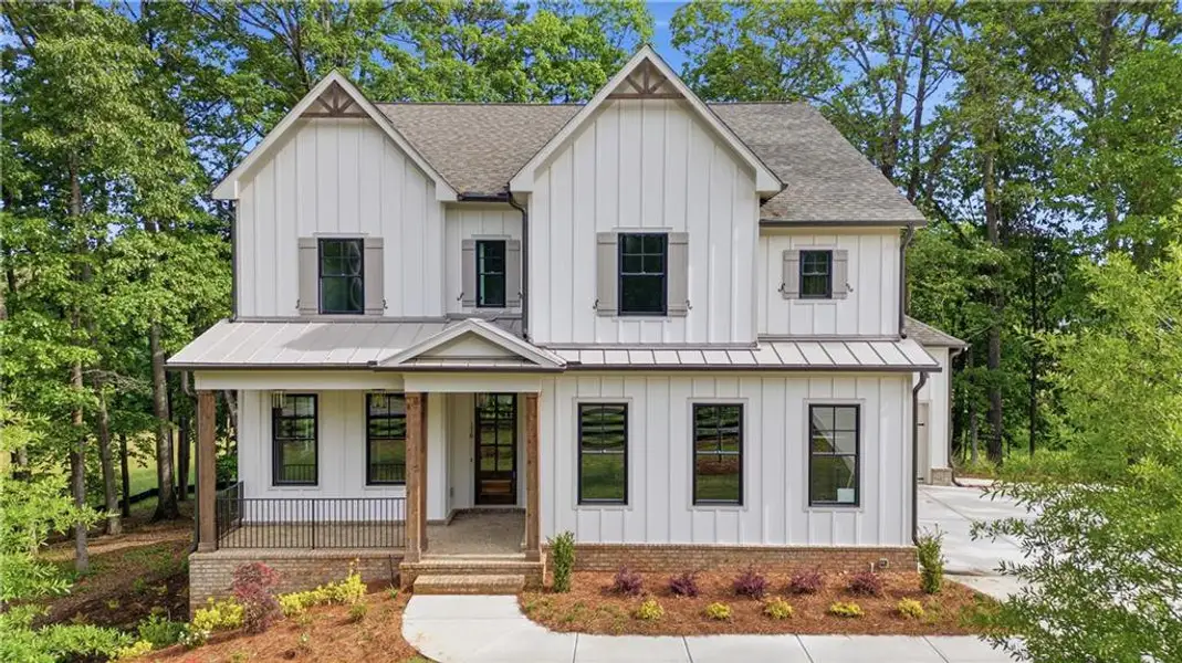 Front exterior of a new home in , Canton, GA, highlighting curb appeal (Image 2). Front exterior of a new home in , Canton, GA, highlighting curb appeal (Image 2).