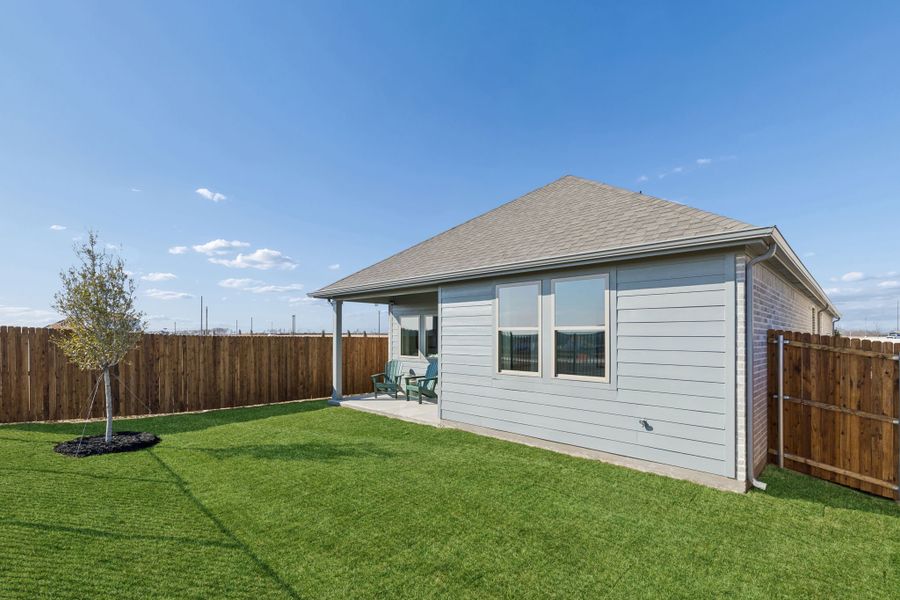 Covered Patio in a Nicholson Ranch Magnolia Model Home in Lavon TX by Trophy Signature Homes