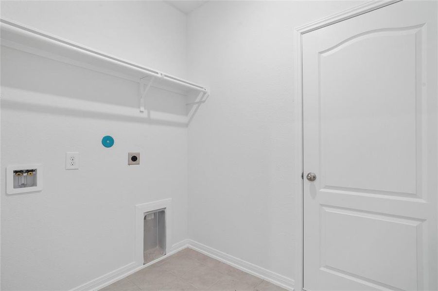 The Utility Room is spacious for your washer & dryer appliances and has a high shelf for all your laundering supplies.