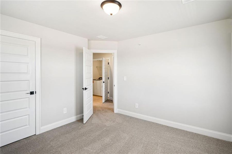 Spacious, unfurnished interior of a new home in Hemingway - Highland Series, Cumming (Image 24).