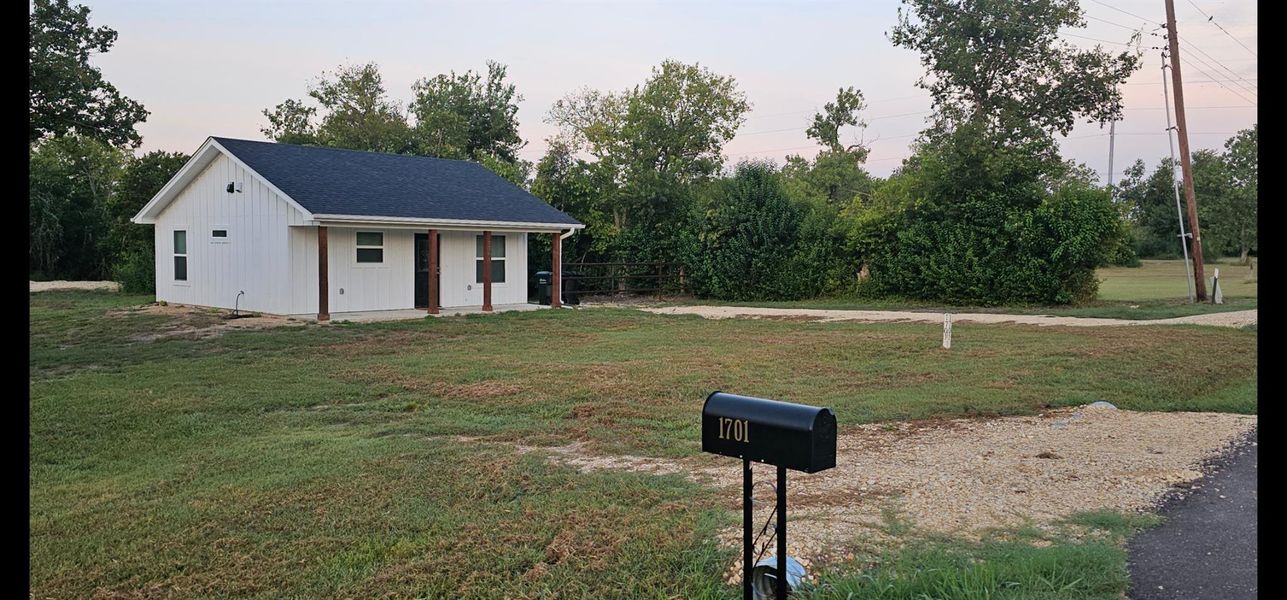 2 entrance adds value. could me used as a circle drive. House is tucked in on 1 side leaving room on 1 acre for small farm animals and or a shop. 2 entrance adds value. could me used as a circle drive. House is tucked in on 1 side leaving room on 1 acre for small farm animals and or a shop.