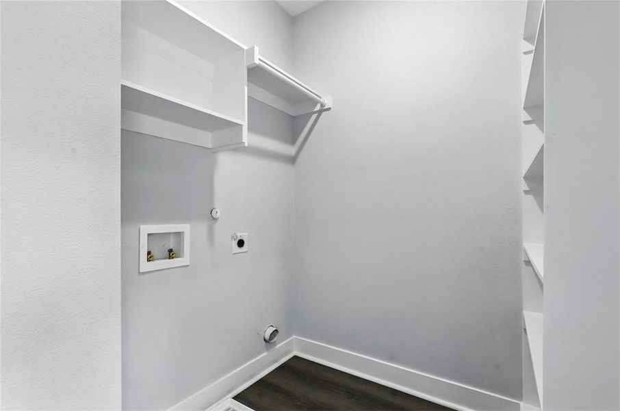 Laundry room featuring hookup for an electric dryer, washer hookup, and dark wood-type flooring