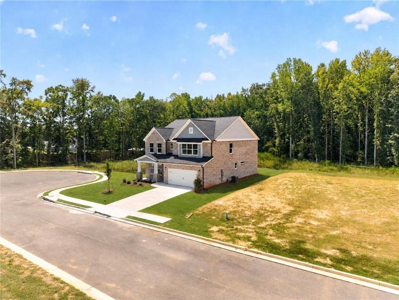Front exterior of a new home in , Loganville, GA, highlighting curb appeal (Image 30). Front exterior of a new home in , Loganville, GA, highlighting curb appeal (Image 30).