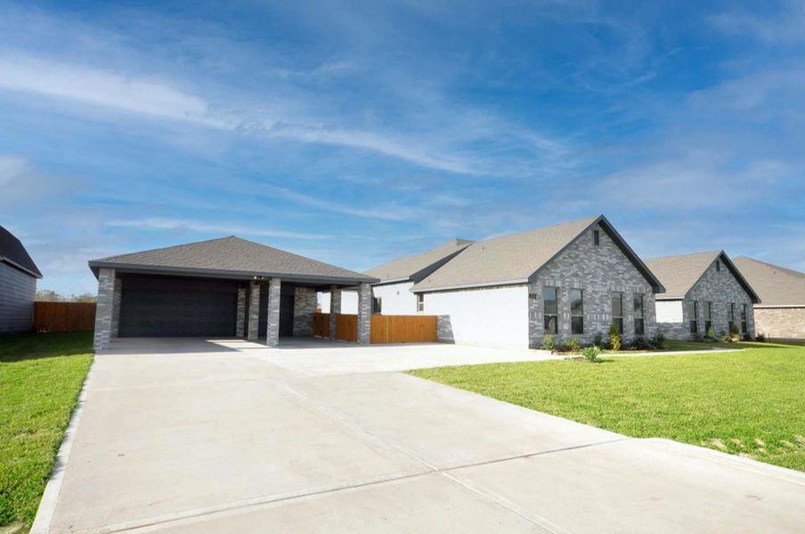 Front exterior of a new home in Pedregal, League City, TX, highlighting curb appeal (Image 1).