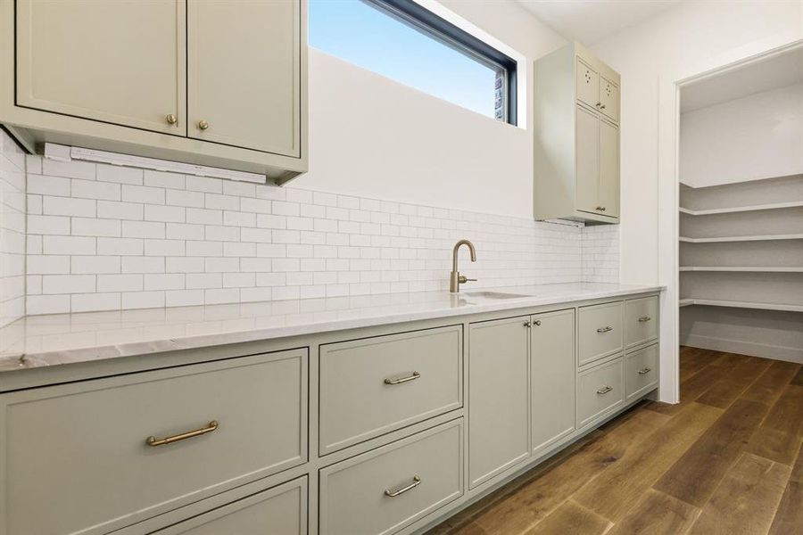 Butler's kitchen and pantry with hidden outlets