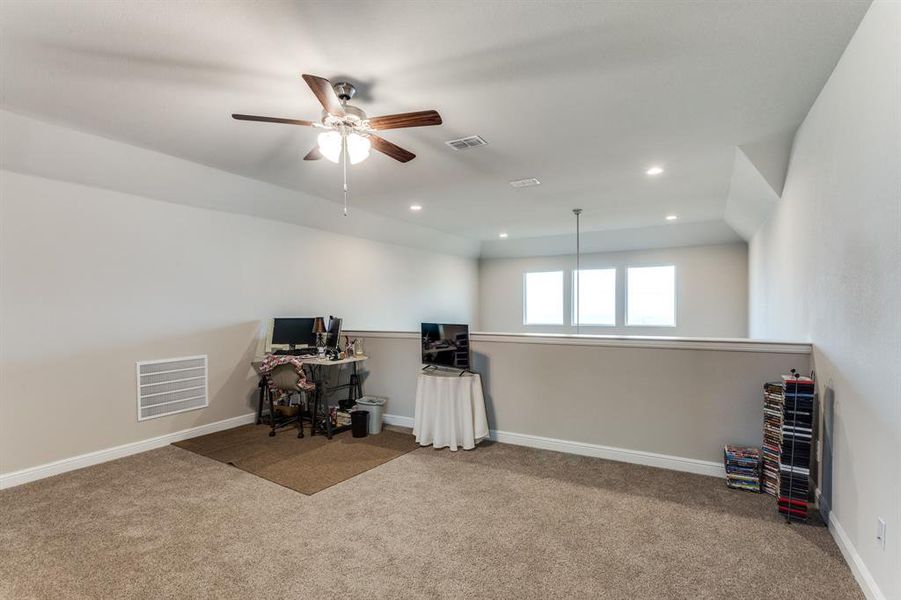 Unfurnished office with light carpet and ceiling fan