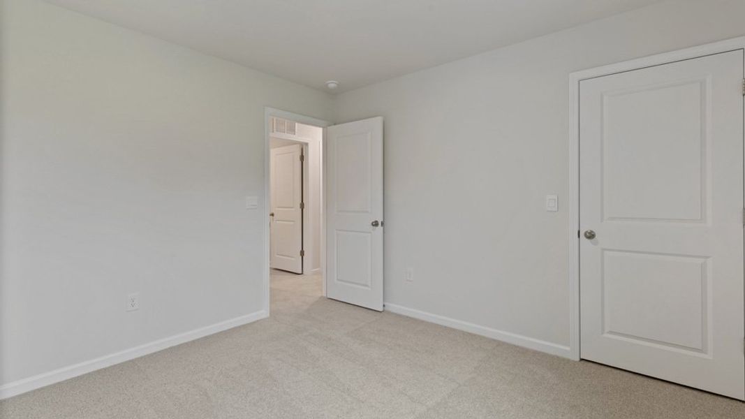 Representative unfurnished interior of a home built from the DARWIN by D.R. Horton in Honeycutt Oaks, Angier (Image 18). Representative unfurnished interior of a home built from the DARWIN by D.R. Horton in Honeycutt Oaks, Angier (Image 18).