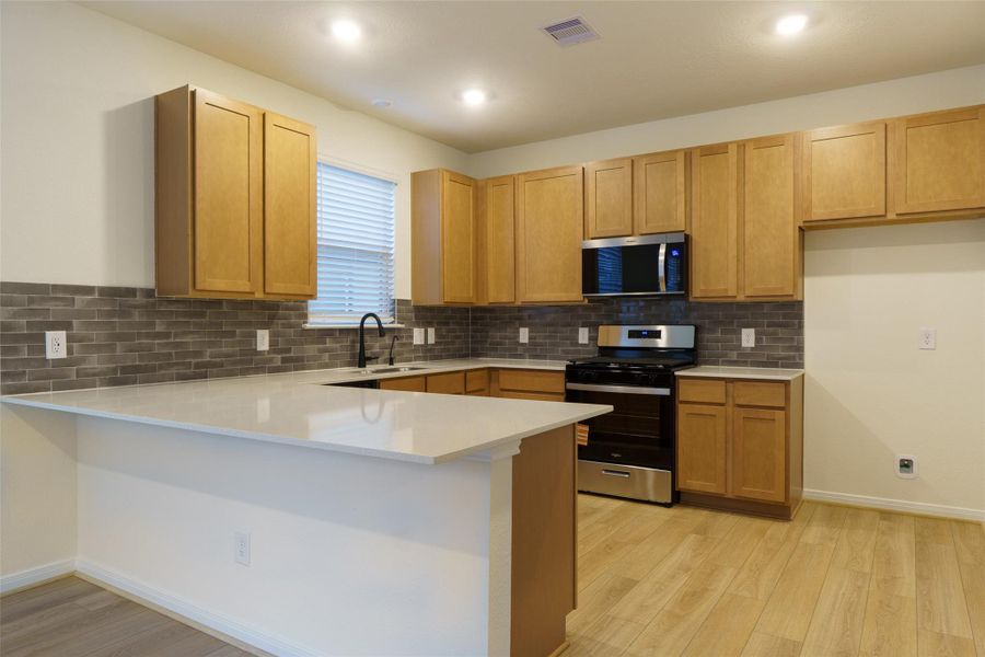 Furnished interior view inside a new home in Oakwood Trails, Tomball (Image 6).