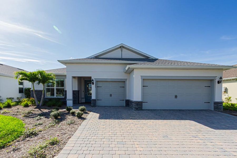 Front exterior of a new home in , Punta Gorda, FL, highlighting curb appeal (Image 2).
