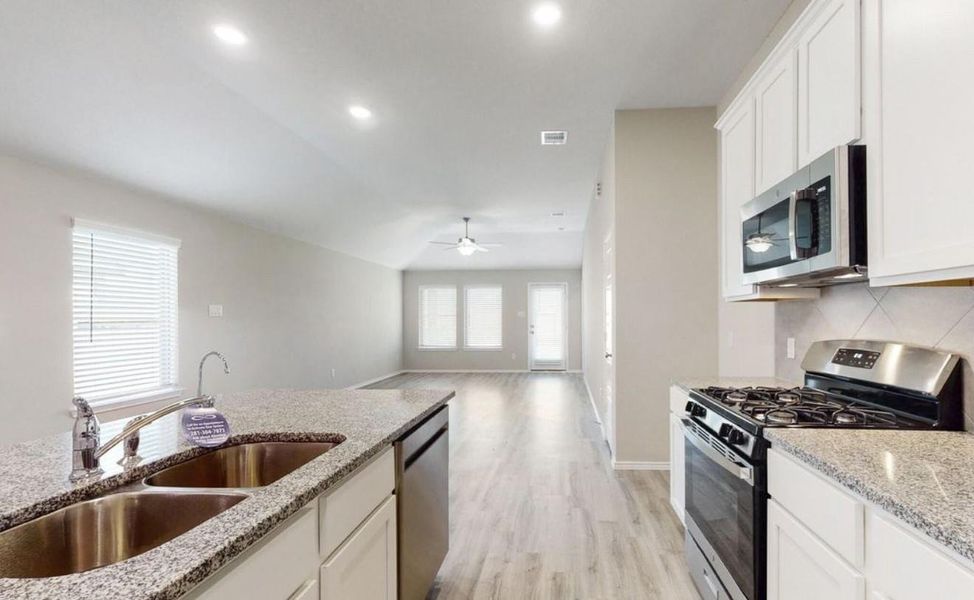 Furnished interior view inside a new home in Mustang Crossing, Alvin (Image 14).