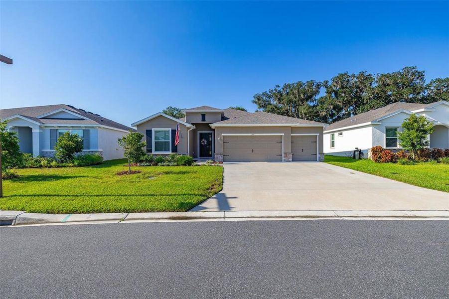 Front exterior of a new home in Farm at Varrea, Plant City, FL, highlighting curb appeal (Image 22). Front exterior of a new home in Farm at Varrea, Plant City, FL, highlighting curb appeal (Image 22).