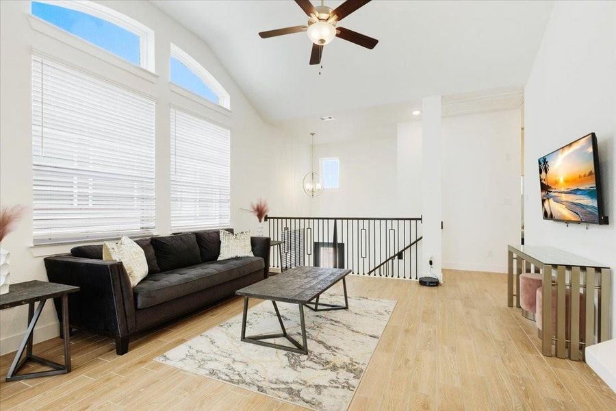 Furnished interior view inside a new home in Meridiana, Iowa Colony (Image 8).