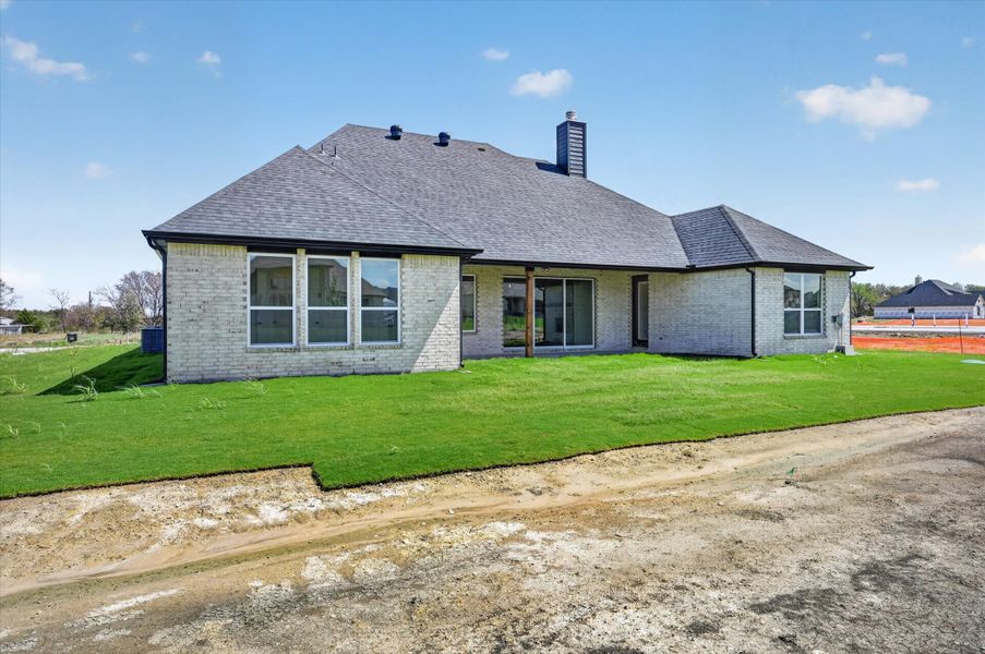 Exterior details and patio area of a home in Paloma Ranches, Justin (Image 3).