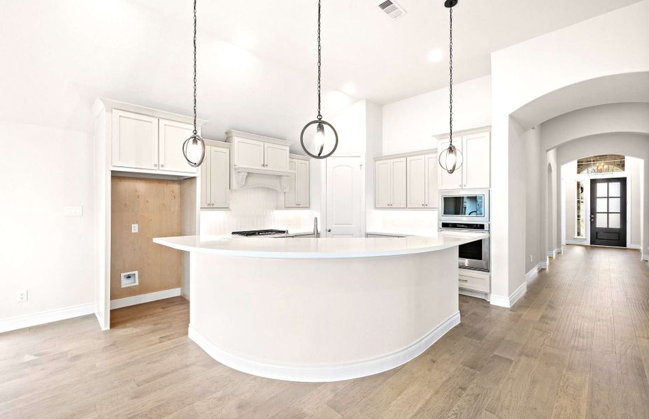 Representative furnished interior of a home built from the 2406 by Ravenna Homes in The Highlands 55′, Porter (Image 10).