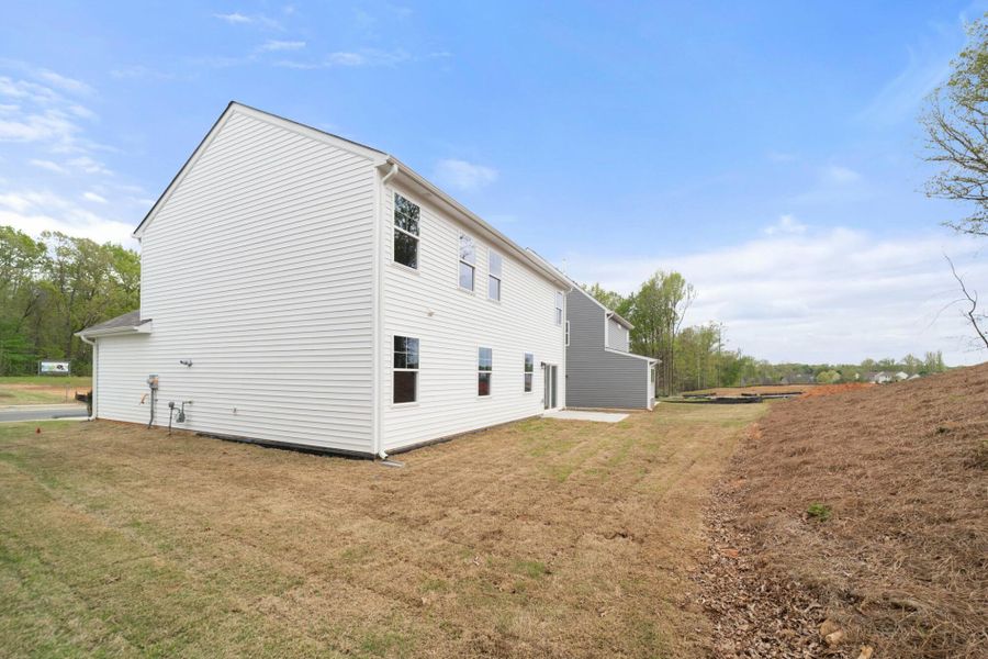 Front exterior of a new home in Chandler Ridge, McLeansville, NC, highlighting curb appeal (Image 17).