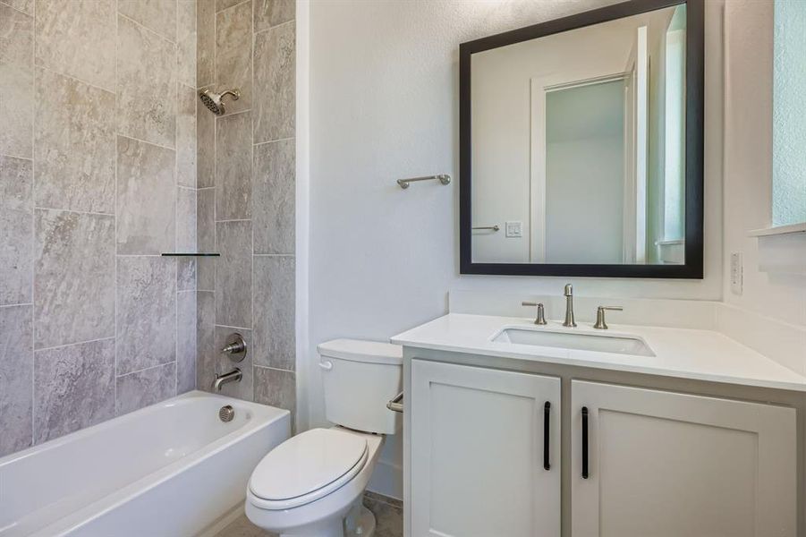 Full bath with vanity and shower / bath combination