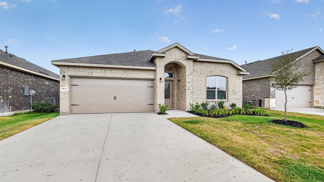 Front exterior of a new home in Legado, Cleburne, TX, highlighting curb appeal (Image 21). Front exterior of a new home in Legado, Cleburne, TX, highlighting curb appeal (Image 21).