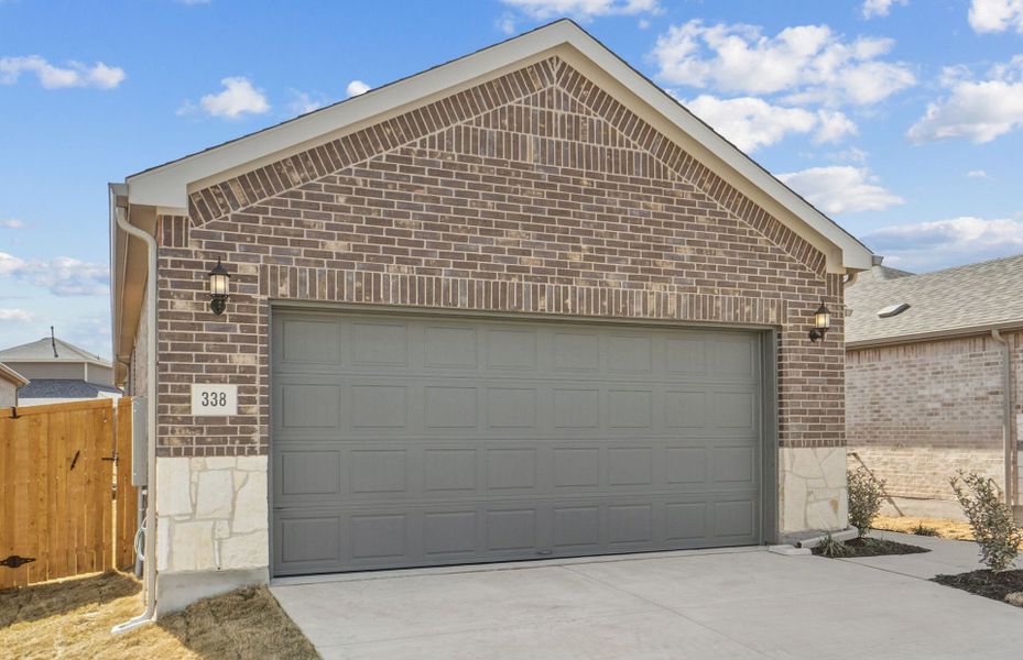 Front exterior of a new home in Crosswinds, Kyle, TX, highlighting curb appeal (Image 18).