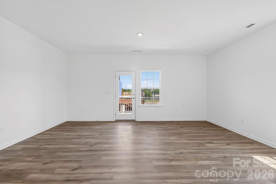 Huge family room opens to the rear balcony
