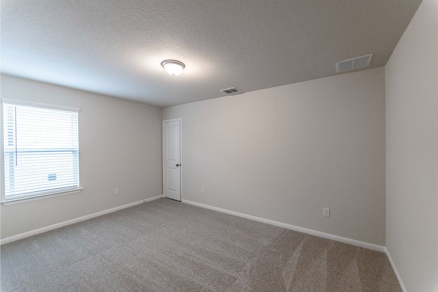 Spacious, unfurnished interior of a new home in The Woodlands at Medina Hills, Mico (Image 18).