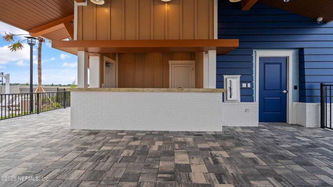 Exterior details and patio area of a home in Lakes at Bella Lago - Signature Series, Green Cove Springs (Image 3).