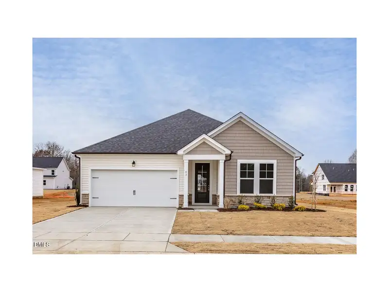 Front exterior of a new home in Wellers Knoll, Lillington, NC, highlighting curb appeal (Image 1). Front exterior of a new home in Wellers Knoll, Lillington, NC, highlighting curb appeal (Image 1).