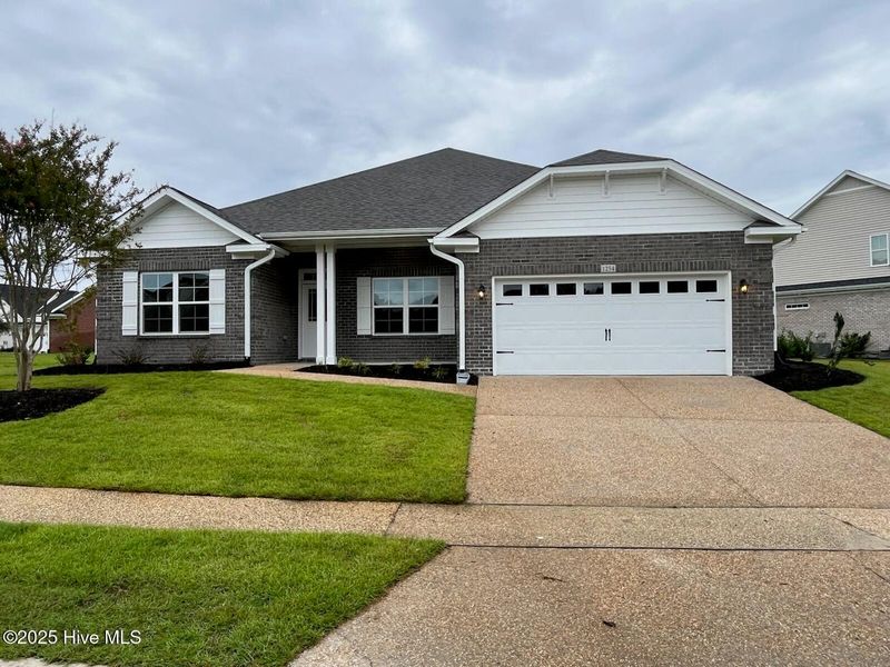 Front exterior of a new home in Palmetto Creek, Bolivia, NC, highlighting curb appeal (Image 1).