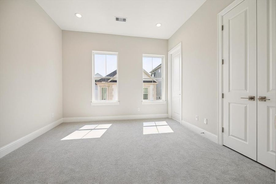 2nd 3rd story bedroom. Large space with lots of natural light.