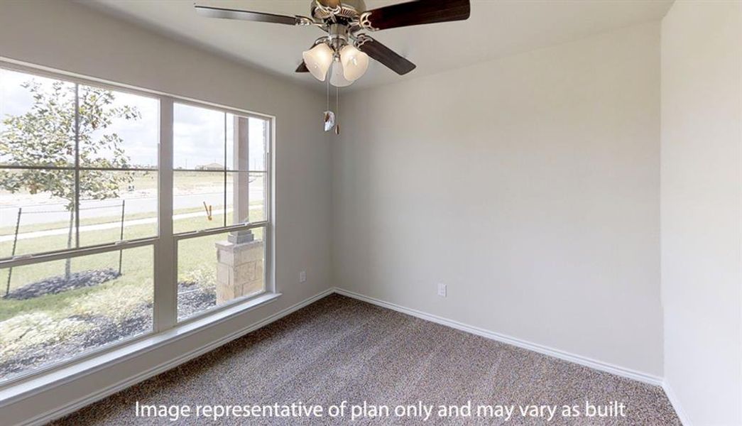 Empty room featuring carpet floors and a ceiling fan Empty room featuring carpet floors and a ceiling fan