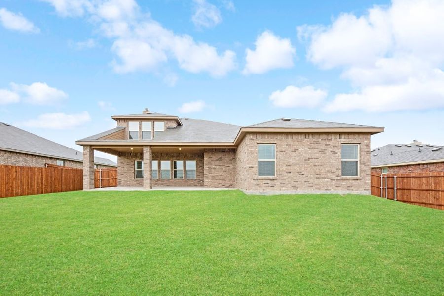 Representative exterior photo of a completed home built from the Radcliffe II by Impression Homes in Stone Eagle, Azle, TX (Image 28).