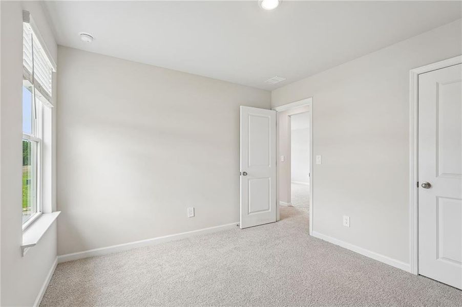 Spacious, unfurnished interior of a new home in Northwoods at Mirror Lake, Villa Rica (Image 54).