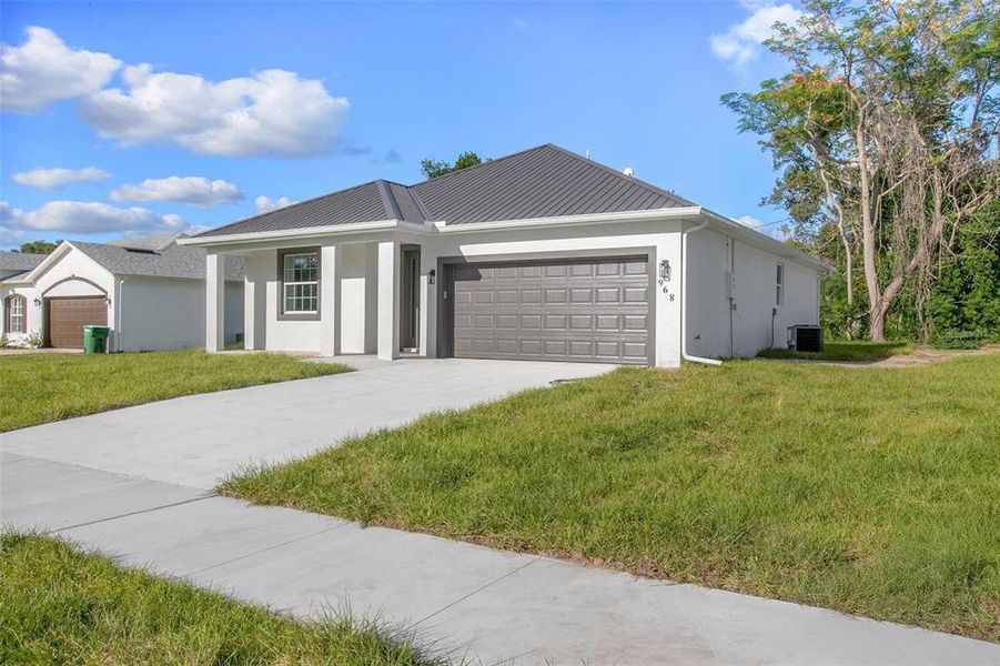 Front exterior of a new home in , Deltona, FL, highlighting curb appeal (Image 16). Front exterior of a new home in , Deltona, FL, highlighting curb appeal (Image 16).