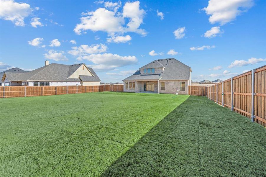 Exterior details and patio area of a home in Settlers Glen, New Fairview (Image 27).