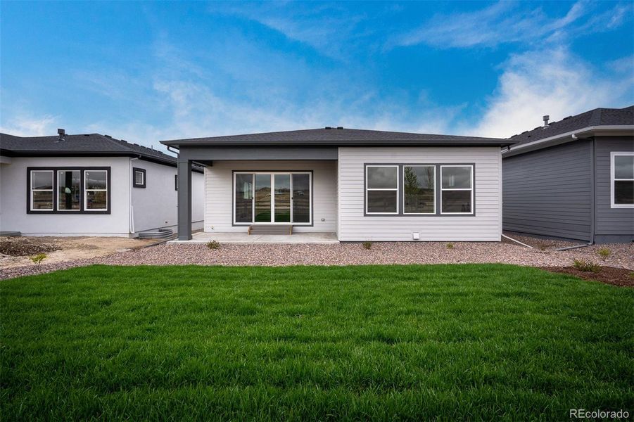 Exterior details and patio area of a home in Wolf Ranch - Enclave Collection, Colorado Springs (Image 3).