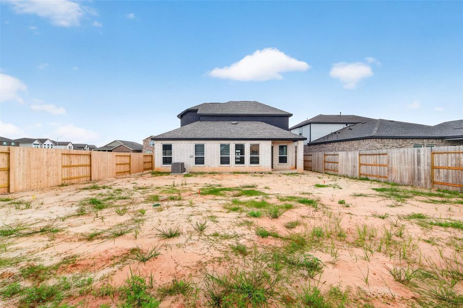 Exterior details and patio area of a home in Sunterra, Katy (Image 27).
