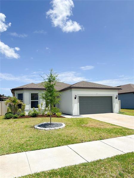 Front exterior of a new home in Marwood, Ellenton, FL, highlighting curb appeal (Image 22). Front exterior of a new home in Marwood, Ellenton, FL, highlighting curb appeal (Image 22).