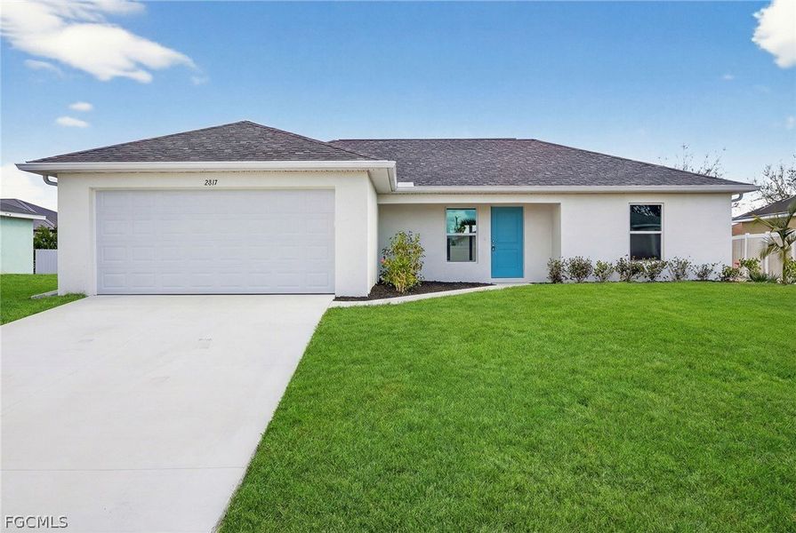 Front exterior of a new home in Cape Coral, Cape Coral, FL, highlighting curb appeal (Image 2). Front exterior of a new home in Cape Coral, Cape Coral, FL, highlighting curb appeal (Image 2).