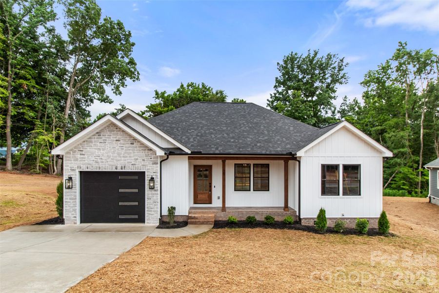 Front exterior of a new home in , Concord, NC, highlighting curb appeal (Image 17). Front exterior of a new home in , Concord, NC, highlighting curb appeal (Image 17).