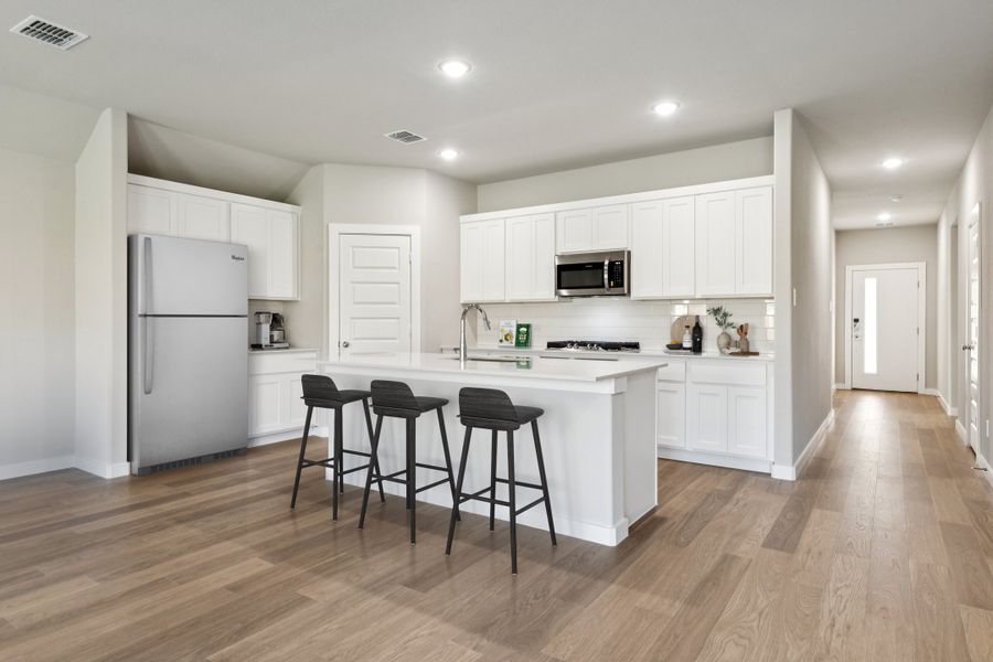 Kitchen in the Emmy II home plan by Trophy Signature Homes - REPRESENTATIVE PHOTO Kitchen in the Emmy II home plan by Trophy Signature Homes - REPRESENTATIVE PHOTO