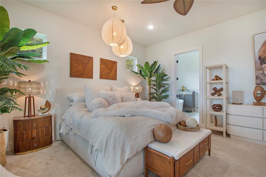 Bedroom featuring light carpet, recessed lighting, and connected bathroom Bedroom featuring light carpet, recessed lighting, and connected bathroom