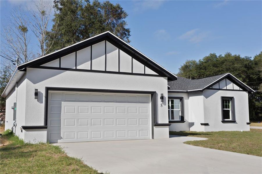 Front exterior of a new home in , Ocala, FL, highlighting curb appeal (Image 13). Front exterior of a new home in , Ocala, FL, highlighting curb appeal (Image 13).