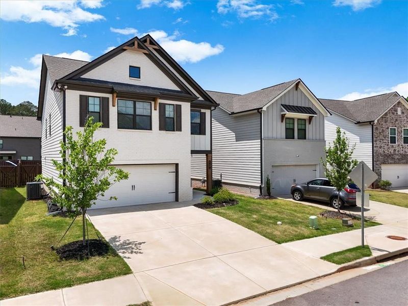 Front exterior of a new home in Crofton Place Enclave, Snellville, GA, highlighting curb appeal (Image 23).