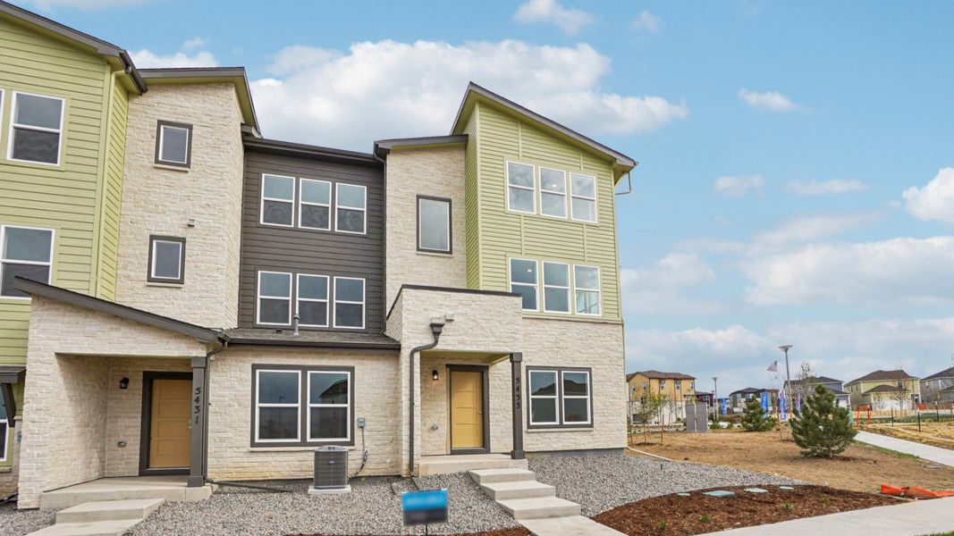 Exterior details and patio area of a home in Windler Townhomes, Aurora (Image 3). Exterior details and patio area of a home in Windler Townhomes, Aurora (Image 3).
