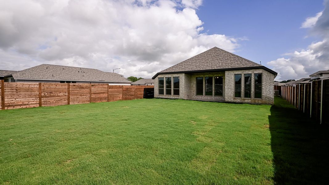 Exterior details and patio area of a home in Juniper Springs, Lockhart (Image 24).