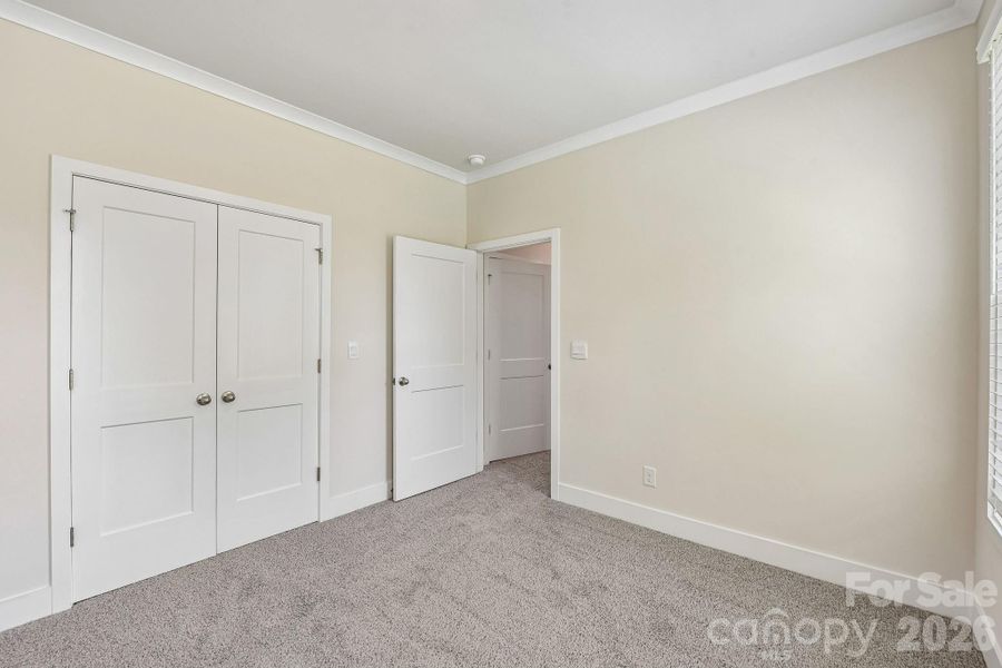 Spacious, unfurnished interior of a new home in Sanctuary at Southgate, Indian Trail (Image 35).
