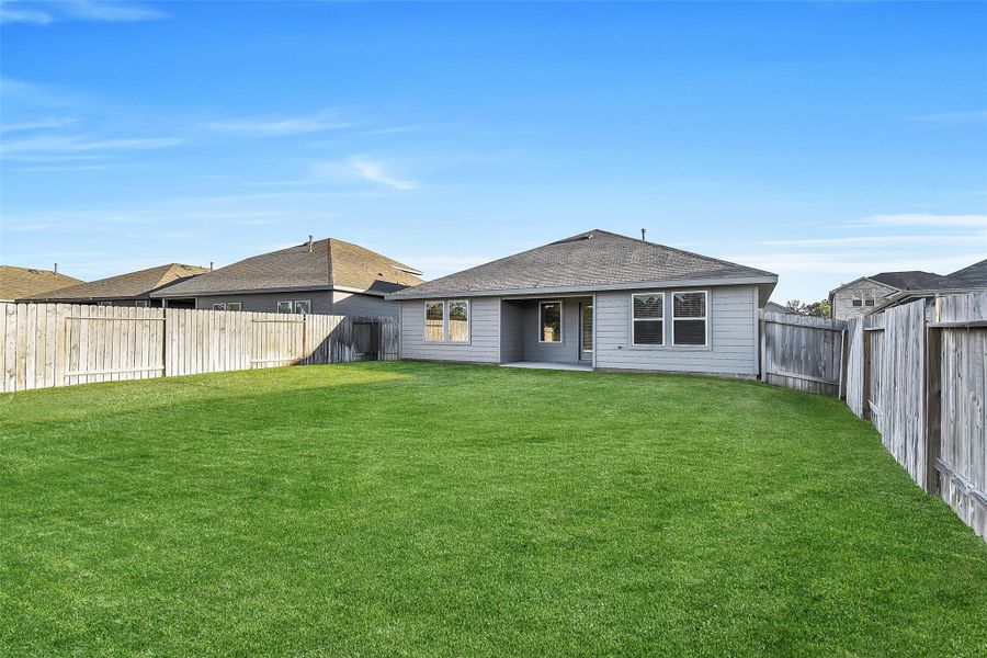 Exterior details and patio area of a home in Summerwood Trails, Willis (Image 21). Exterior details and patio area of a home in Summerwood Trails, Willis (Image 21).