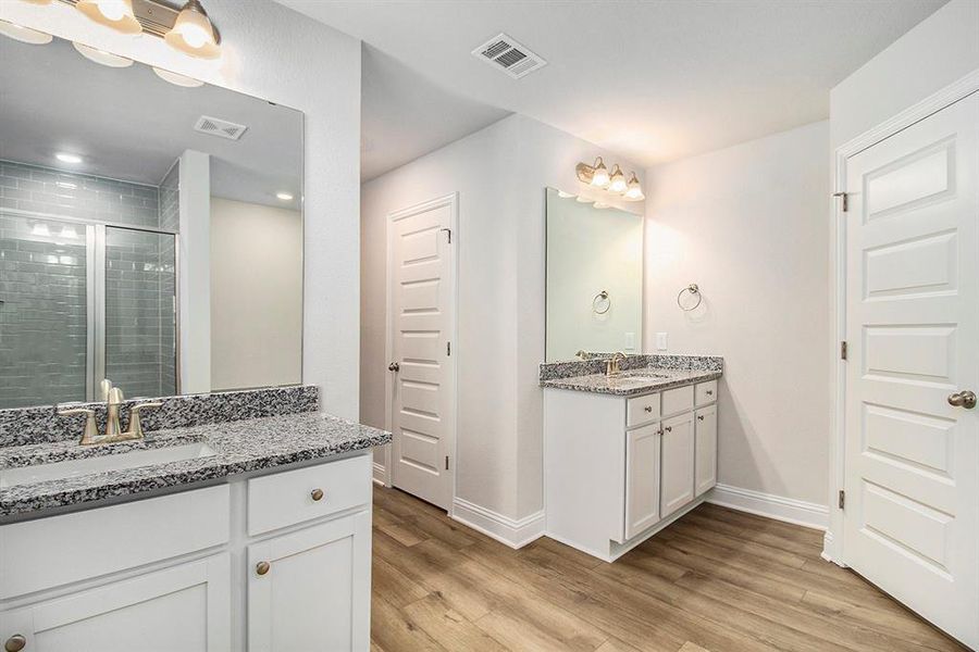 Primary Bathroom with Separate Vanities